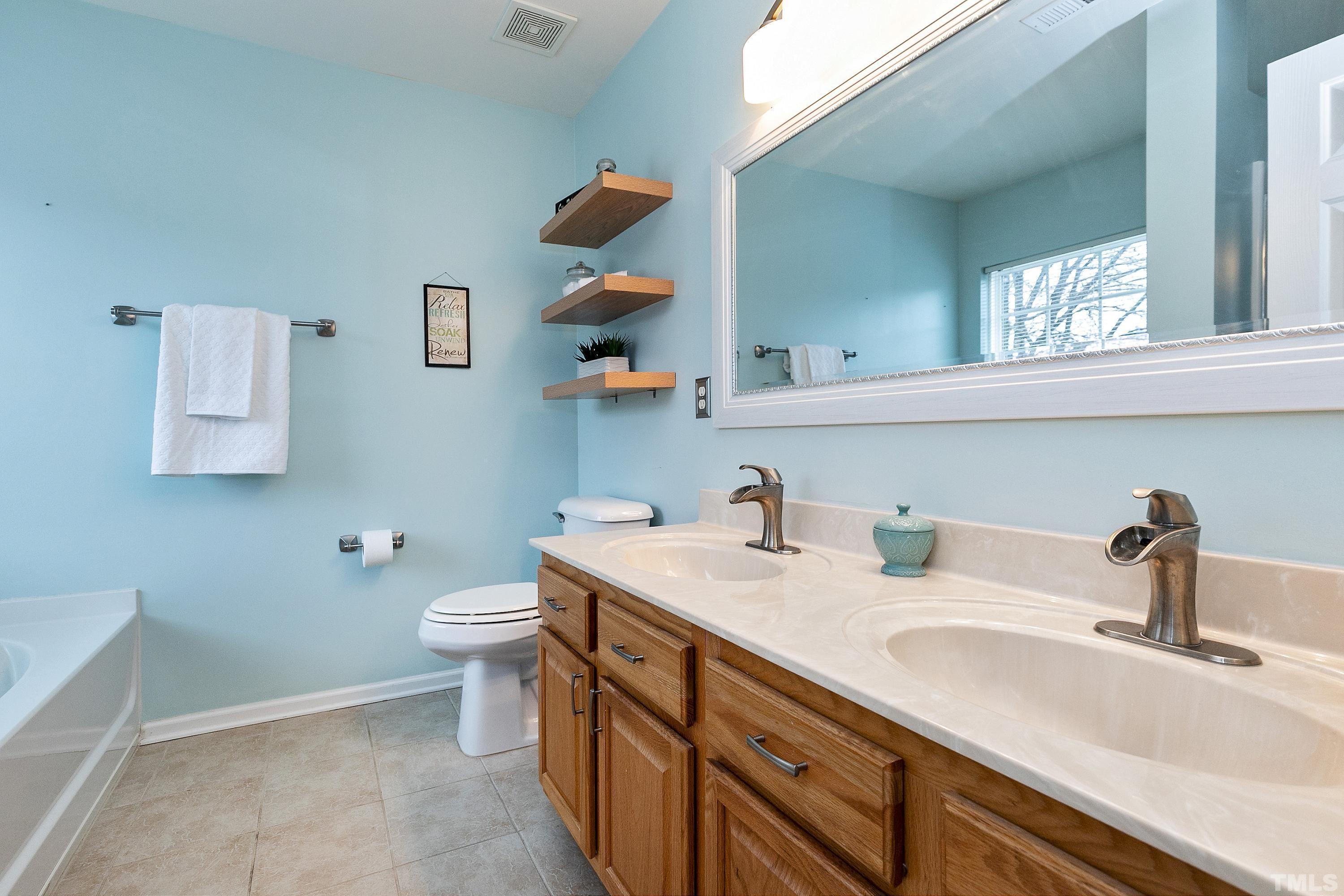 160 Solheim Lane Raleigh, NC 27603 - Photo 18 of 33 a bathroom with a sink and a toilet