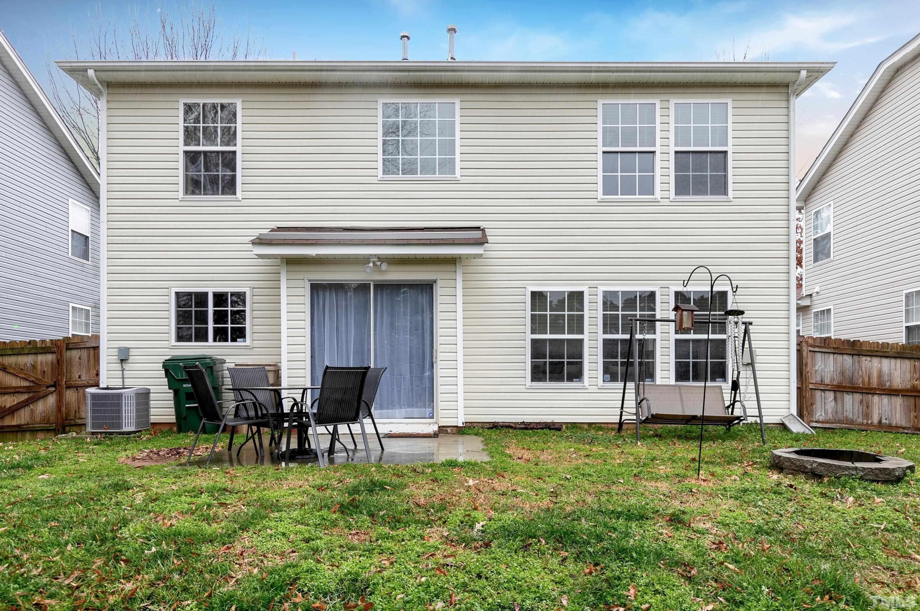 160 Solheim Lane Raleigh, NC 27603 - Photo 27 of 33 a backyard of a house with table and chairs