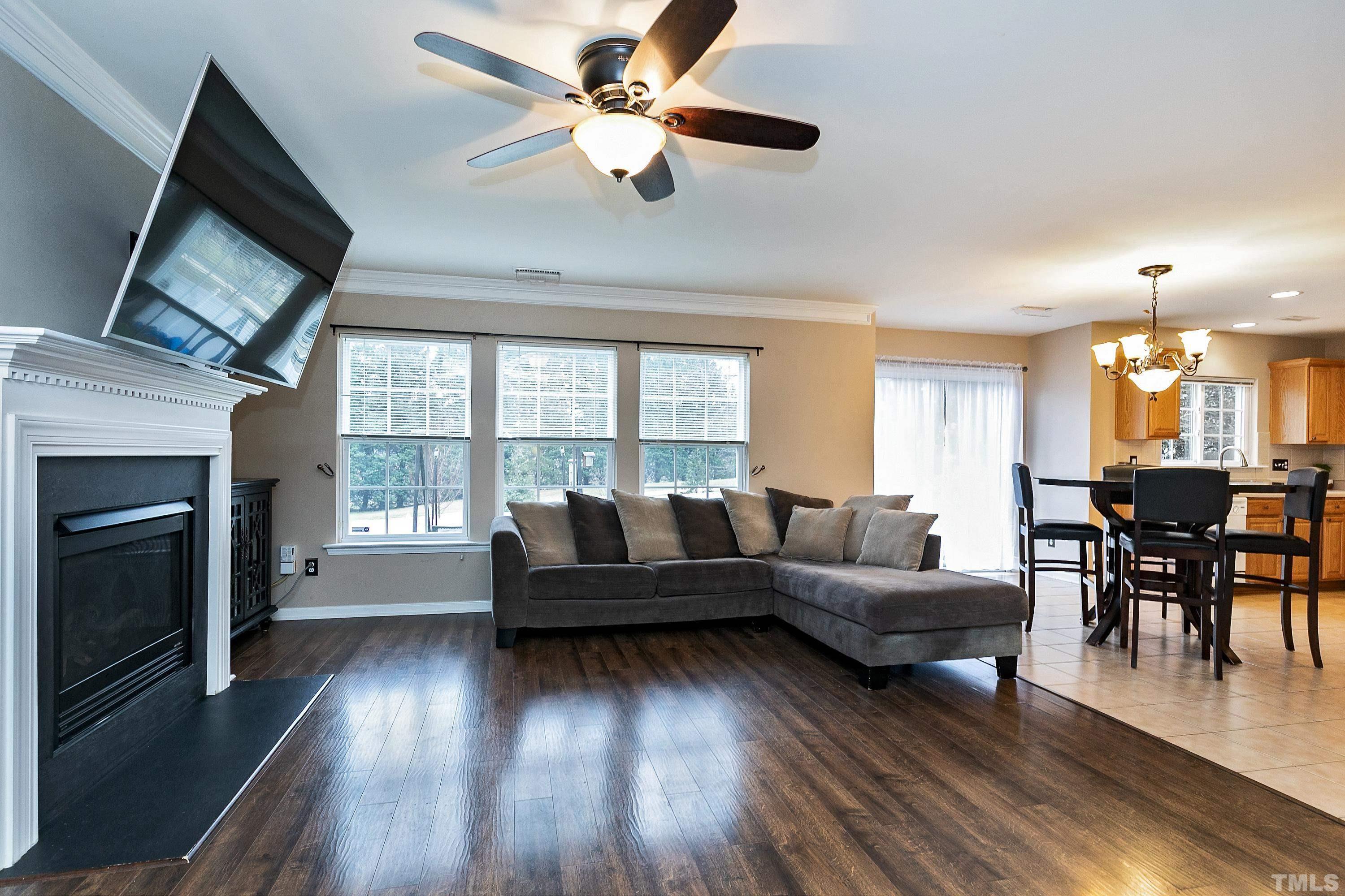 160 Solheim Lane Raleigh, NC 27603 - Photo 6 of 33 a living room with furniture and a fireplace