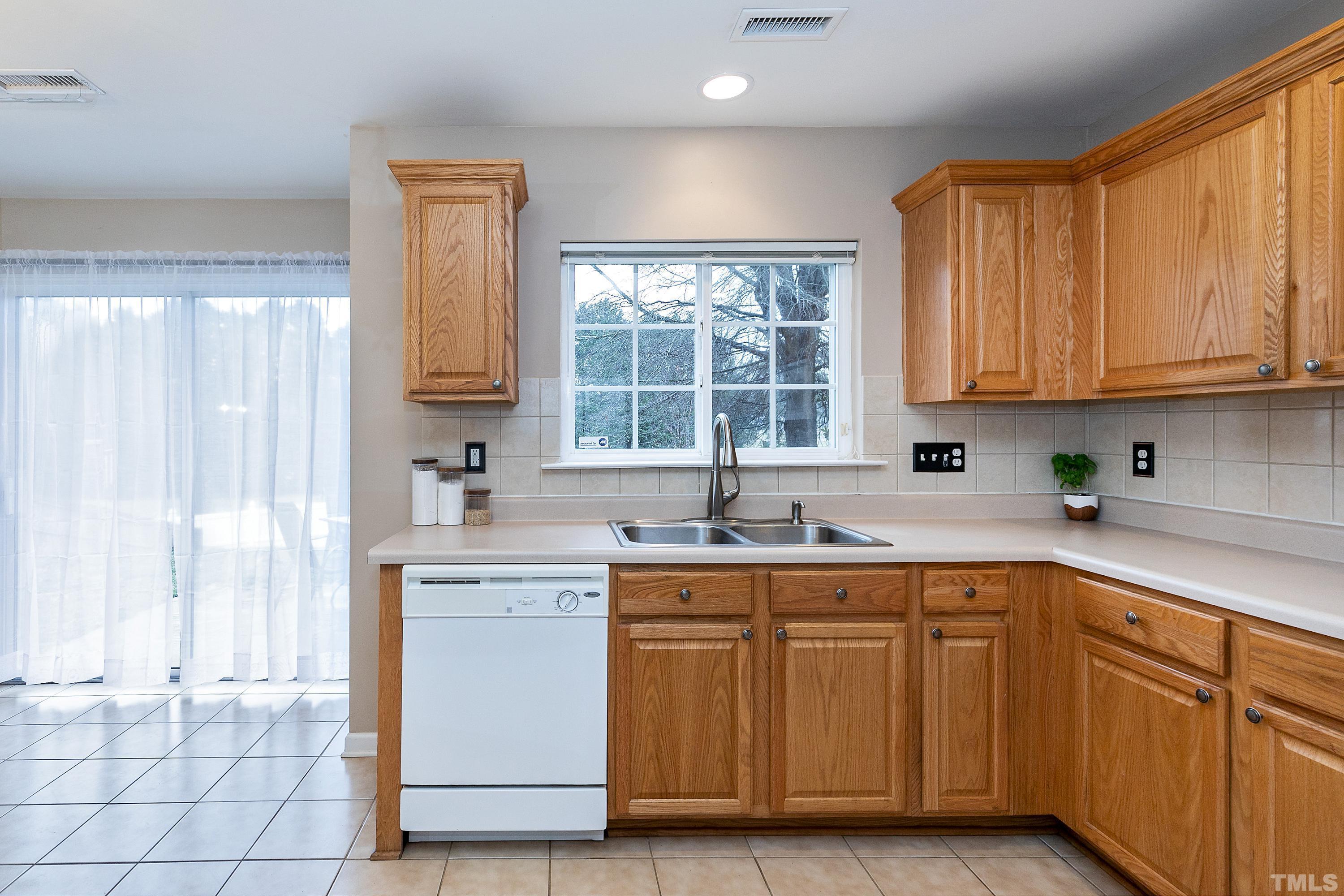 160 Solheim Lane Raleigh, NC 27603 - Photo 10 of 33 a kitchen with a sink cabinets and window