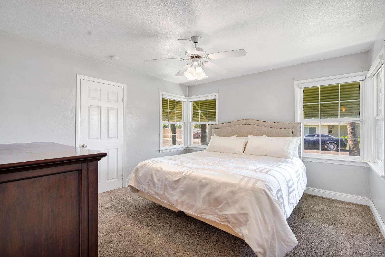 200 Lyons Street Madera, CA 93638 - Photo 24 of 32 a bedroom with a bed and a window