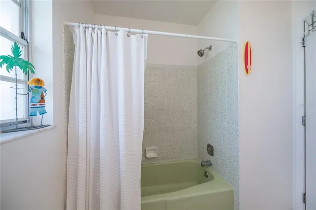 a building outdoor space with patio furniture and garden