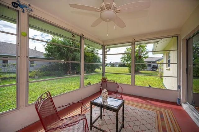 a front view of house with yard and outdoor seating