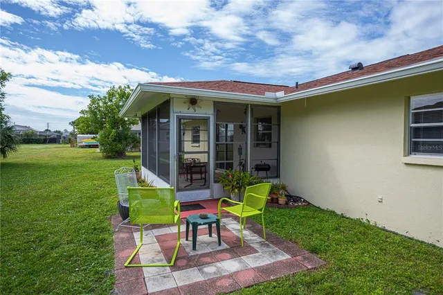 a view of a house with porch and garden