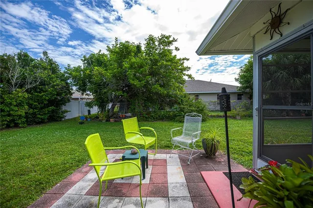 a view of an house with backyard space and garden