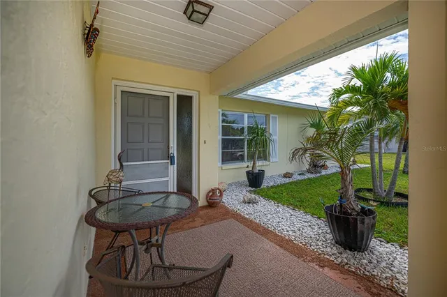 a view of house with backyard porch and furniture