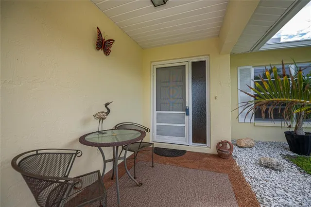 a bedroom with bed and wooden floor
