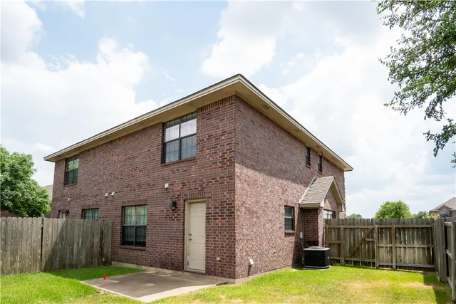 a view of a house with wooden floor and a yard