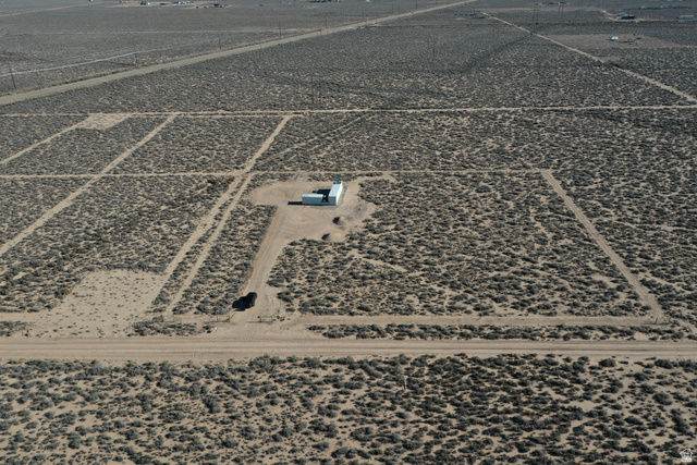 265 South 700 East Beryl, UT 84714 - Photo 8 of 10 Aerial view of property and surrounding area featuring rural landscape and a desert landscape
