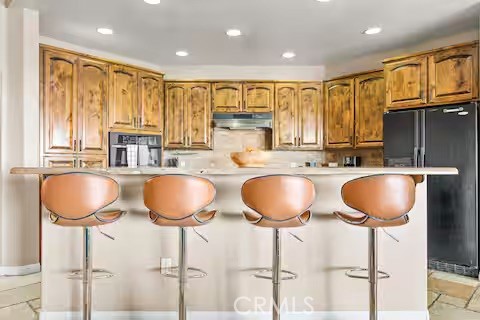 62398 Lilley Road Joshua Tree, CA 92252 - Photo 13 of 70 a kitchen with granite countertop a sink a window cabinets and stainless steel appliances
