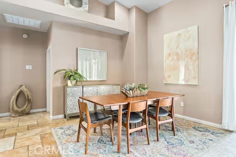 62398 Lilley Road Joshua Tree, CA 92252 - Photo 18 of 70 a dining room with furniture and potted plants