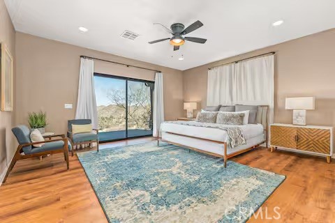62398 Lilley Road Joshua Tree, CA 92252 - Photo 21 of 70 a living room with a bed furniture and next to a window