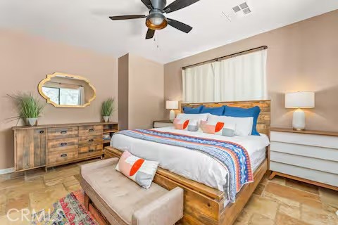 62398 Lilley Road Joshua Tree, CA 92252 - Photo 38 of 70 a bedroom with a bed and dresser