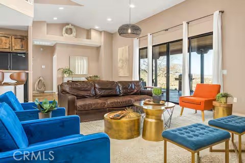 62398 Lilley Road Joshua Tree, CA 92252 - Photo 4 of 70 a living room with furniture and a large window