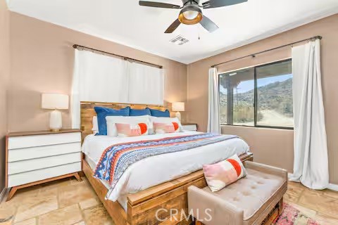 62398 Lilley Road Joshua Tree, CA 92252 - Photo 41 of 70 a bedroom with a bed and a window