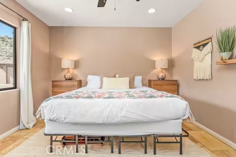 62398 Lilley Road Joshua Tree, CA 92252 - Photo 46 of 70 a bedroom with a bed and a night stand