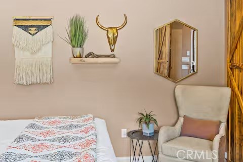 62398 Lilley Road Joshua Tree, CA 92252 - Photo 47 of 70 a bedroom with a bed and painting on the wall