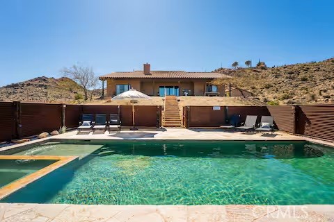 62398 Lilley Road Joshua Tree, CA 92252 - Photo 59 of 70 a view of a house with swimming pool and sitting area