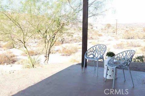 62398 Lilley Road Joshua Tree, CA 92252 - Photo 60 of 70 a view of a terrace with furniture and a yard