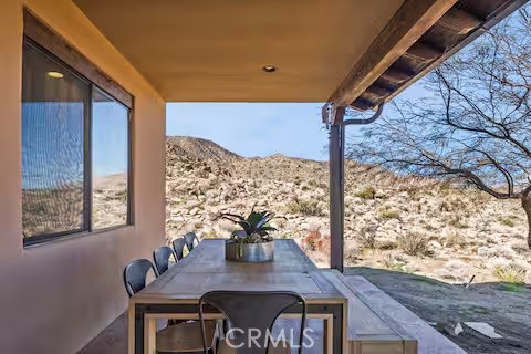 62398 Lilley Road Joshua Tree, CA 92252 - Photo 61 of 70 a view of a dining room with furniture and wooden floor