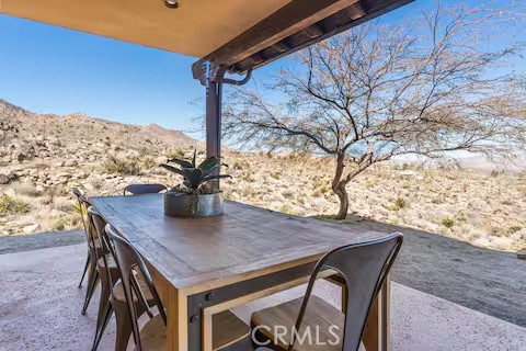 62398 Lilley Road Joshua Tree, CA 92252 - Photo 62 of 70 a view of a terrace with a table and chairs