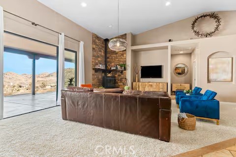62398 Lilley Road Joshua Tree, CA 92252 - Photo 7 of 70 a living room with furniture a flat screen tv and floor to ceiling window