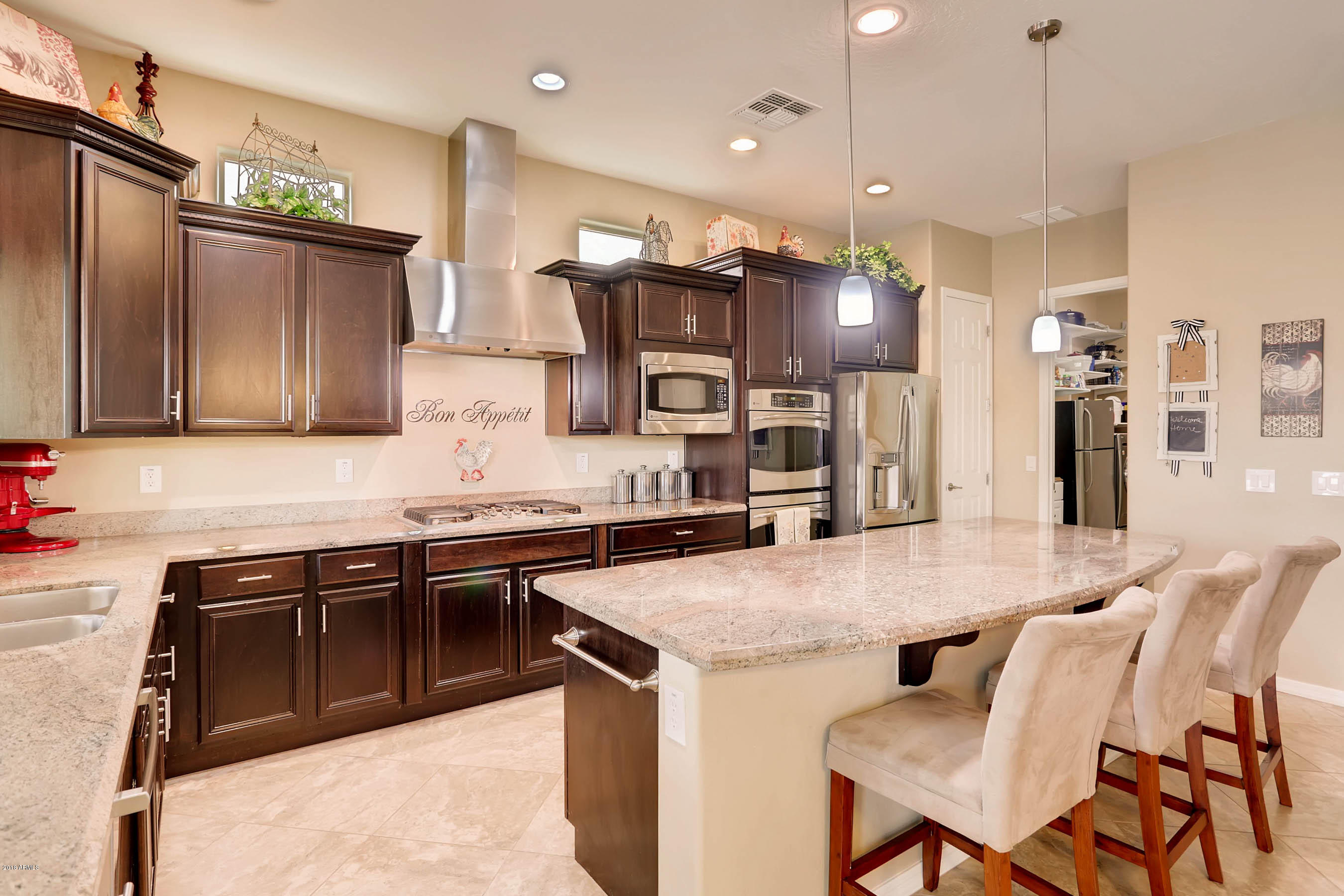 16160 West Berkeley Road Goodyear, AZ 85395 - Photo 7 of 28 Kitchen view of island