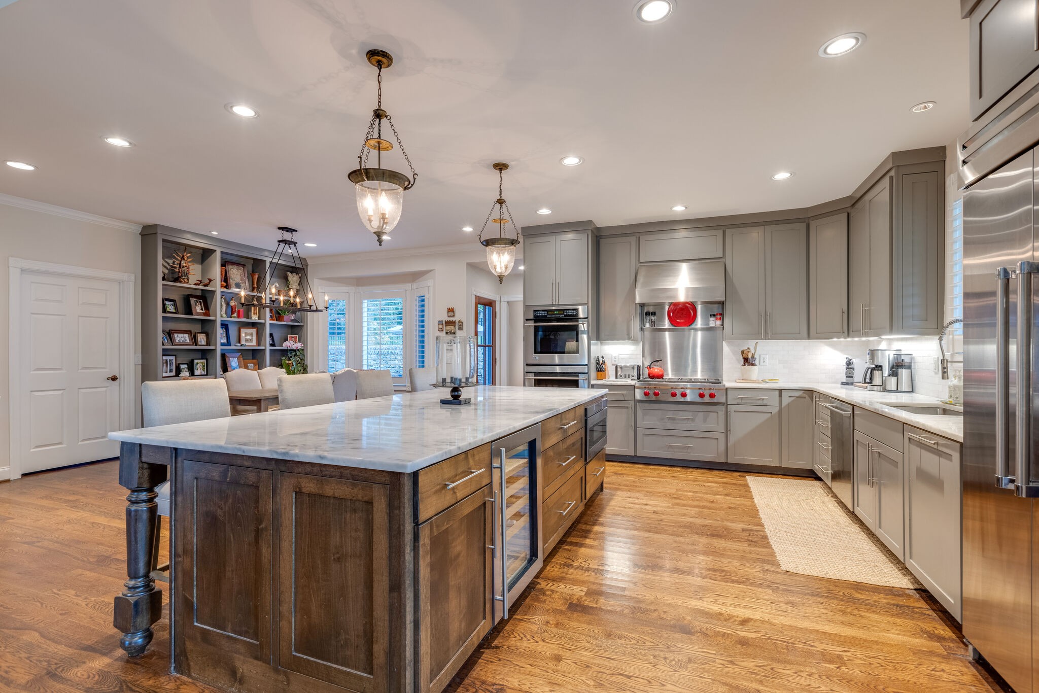 3151 McMillan Road Franklin, TN 37064 - Photo 19 of 46 a large kitchen with kitchen island a sink a counter top space a stove and a center island
