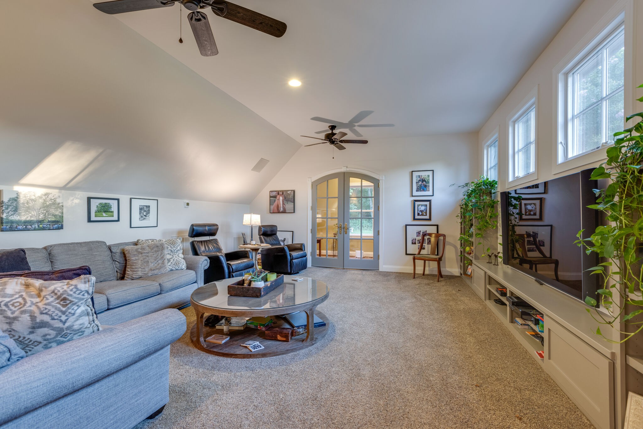 3151 McMillan Road Franklin, TN 37064 - Photo 38 of 46 a living room with furniture a flat screen tv and a large window