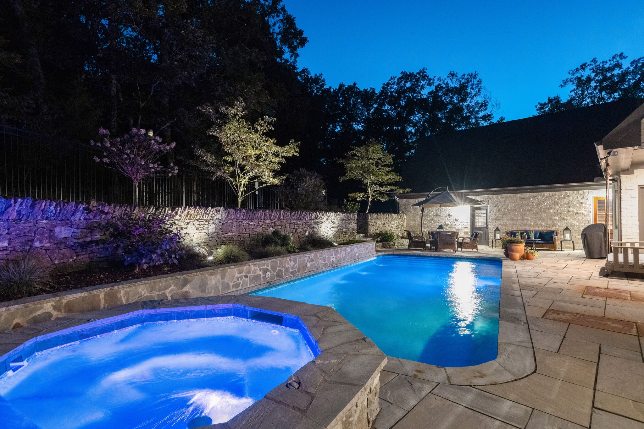 3151 McMillan Road Franklin, TN 37064 - Photo 6 of 46 a swimming pool with outdoor seating and flowers