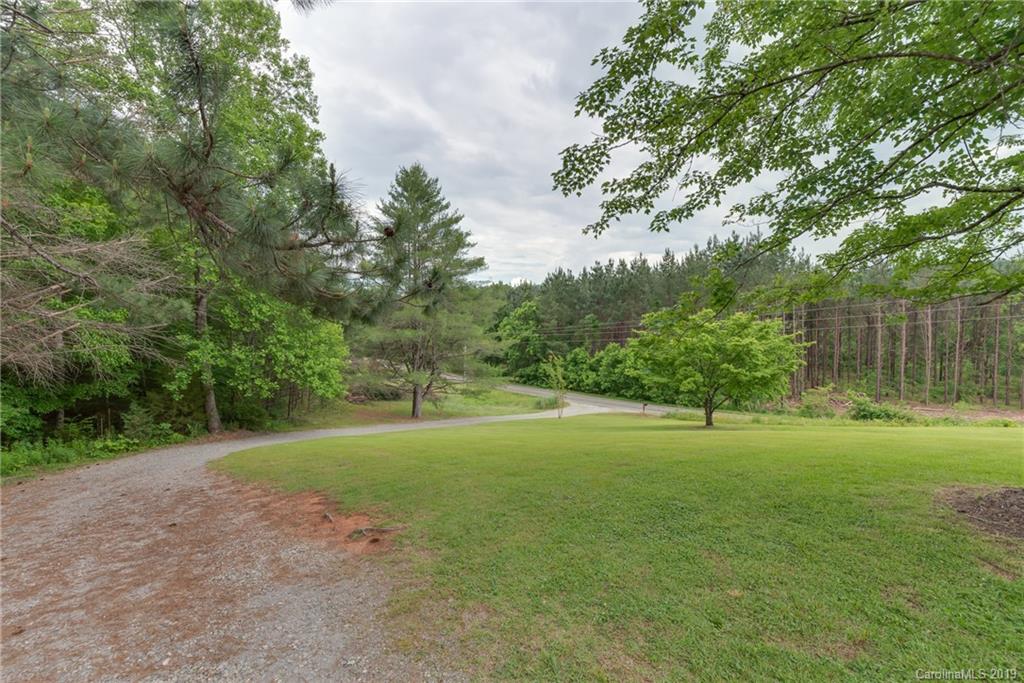 2760 Maple Creek Road Rutherfordton, NC 28139 - Photo 4 of 26 a view of a big yard with plants and large trees