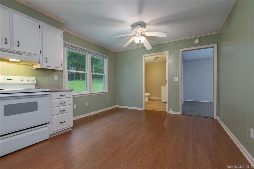 2760 Maple Creek Road Rutherfordton, NC 28139 - Photo 9 of 26 a view of a kitchen with dishwasher and a stove top oven