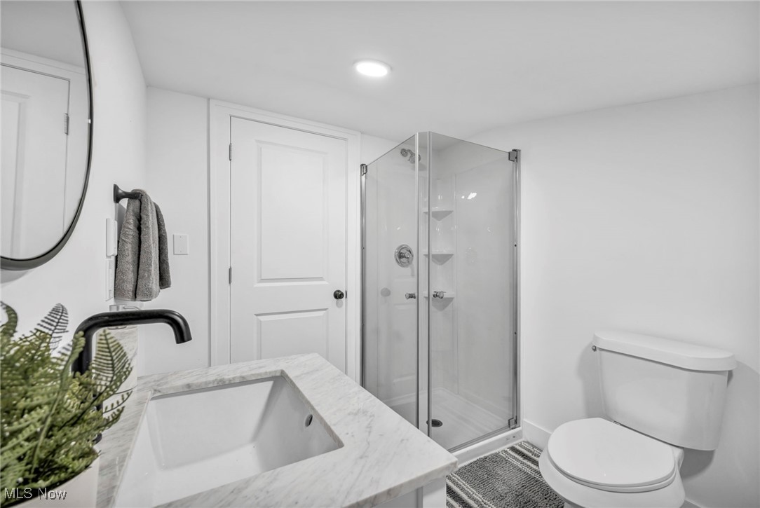 2128 Hampstead Road Cleveland Heights, OH 44118 - Photo 17 of 32 Full bathroom with vanity, a stall shower, and recessed lighting