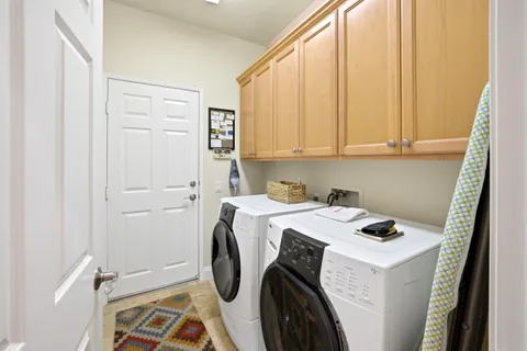a view of storage and utility room with washer and dryer