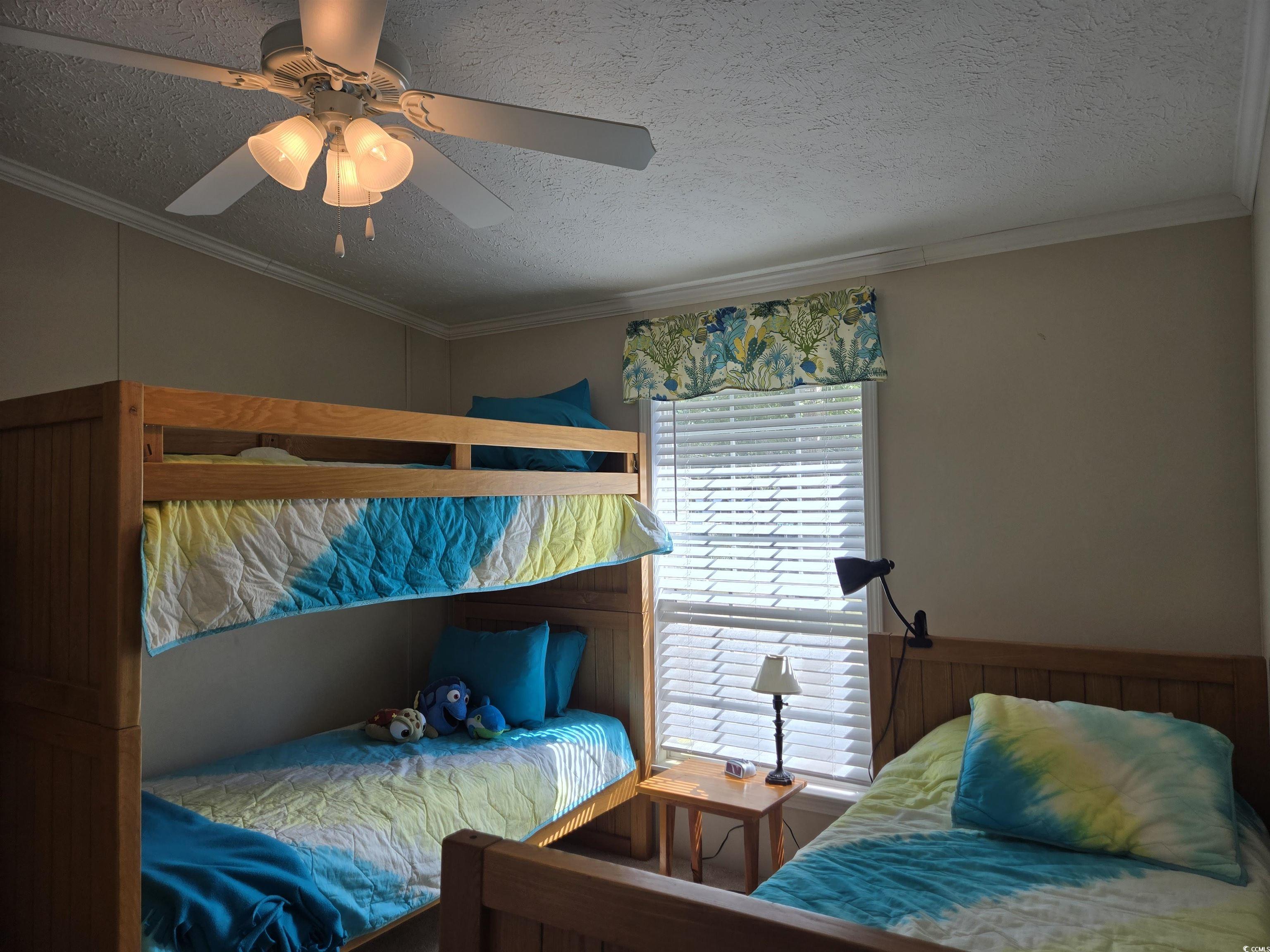 337 Clam Shell Circle Murrells Inlet, SC 29576 - Photo 21 of 29 Bedroom with a textured ceiling, crown molding, and ceiling fan