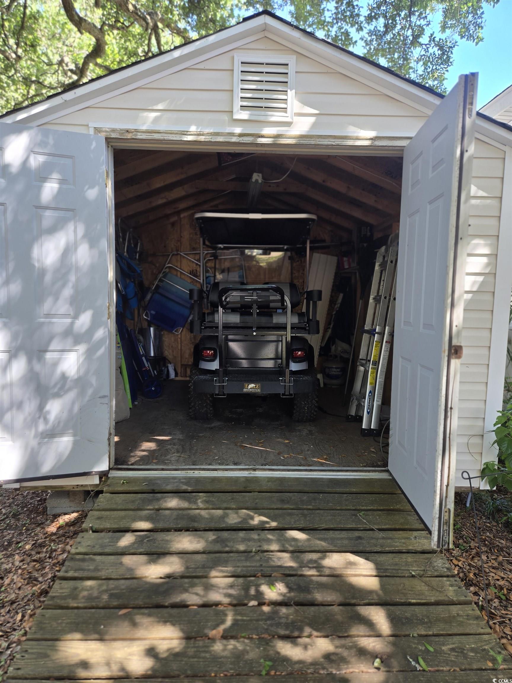 337 Clam Shell Circle Murrells Inlet, SC 29576 - Photo 7 of 29 View of vehicle parking with a detached garage