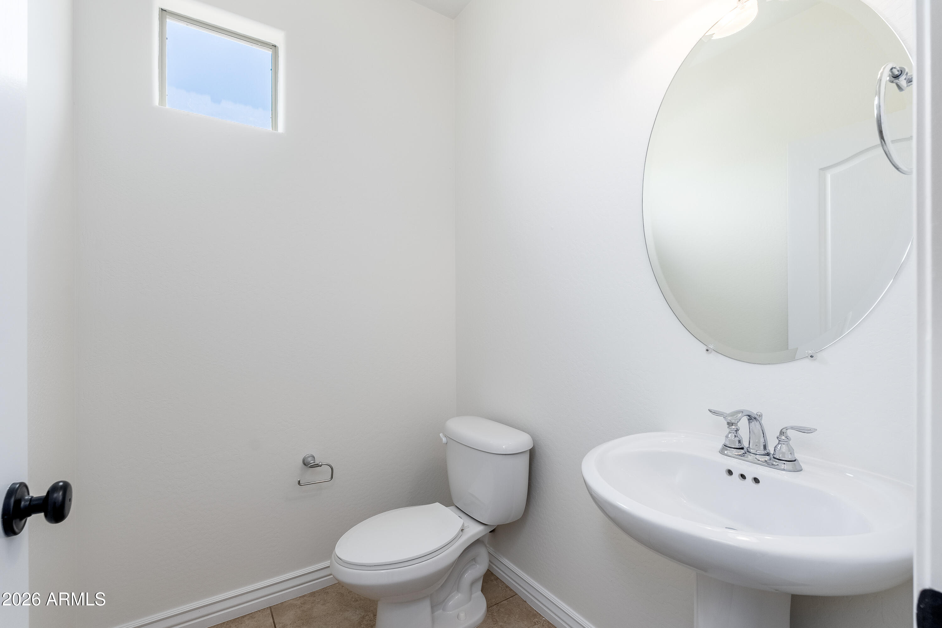 4317 East Folgers Road Phoenix, AZ 85050 - Photo 22 of 40 a bathroom with a sink a toilet and a mirror