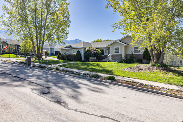 892 East 400 South Smithfield, UT 84335 - Photo 2 of 44 Rambler home with stone siding and a residential view