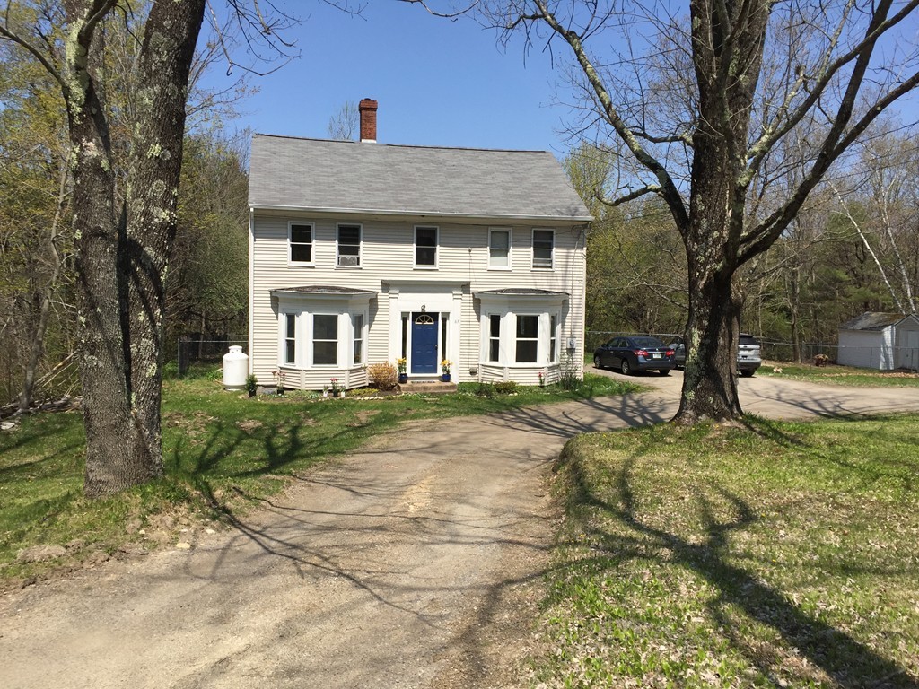 69 East Main Street Rindge, NH 03461 - Photo 1 of 27 a front view of a house with a yard
