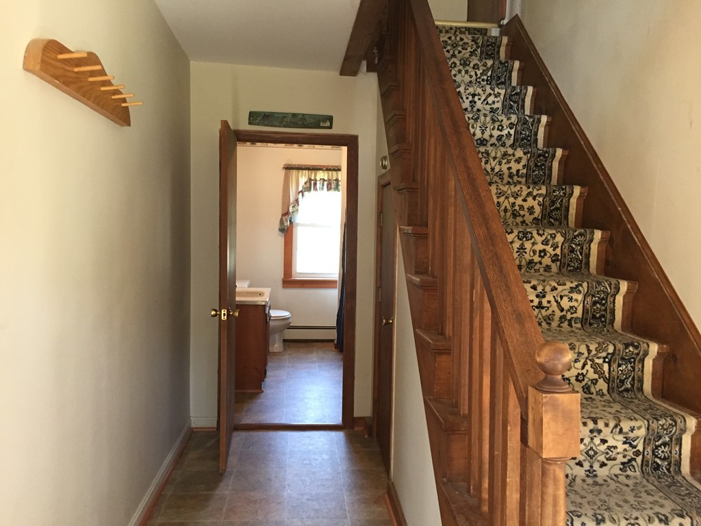 69 East Main Street Rindge, NH 03461 - Photo 13 of 27 a view of hallway with wooden floor