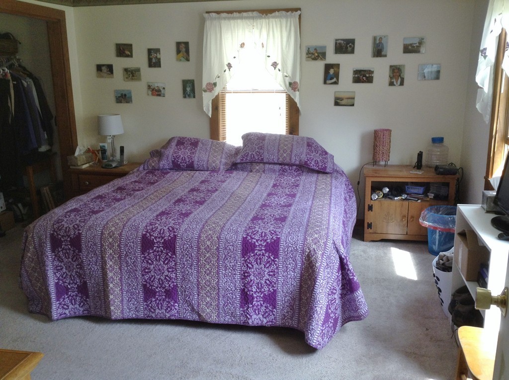 69 East Main Street Rindge, NH 03461 - Photo 17 of 27 a spacious bedroom with a bed and a window in it