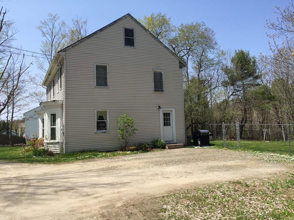 69 East Main Street Rindge, NH 03461 - Photo 23 of 27 a front view of a house with a yard