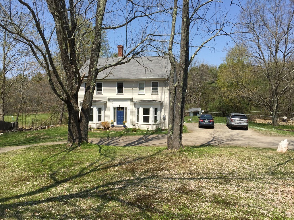 69 East Main Street Rindge, NH 03461 - Photo 24 of 27 a front view of a house with garden