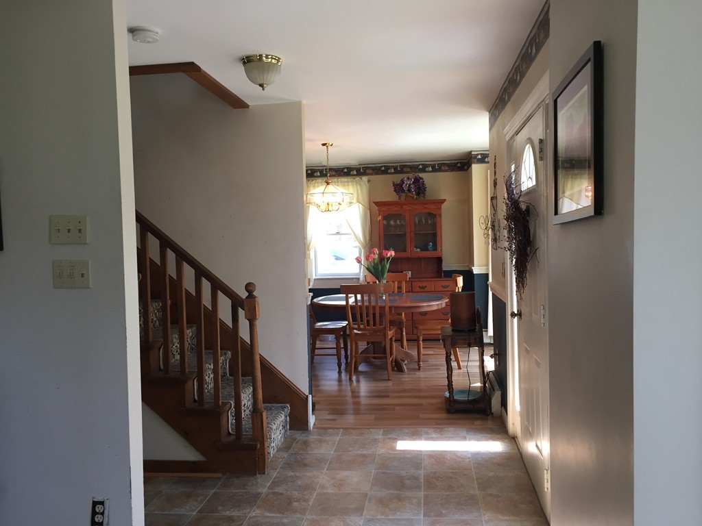 69 East Main Street Rindge, NH 03461 - Photo 5 of 27 a view of a hallway with dining area and entryway