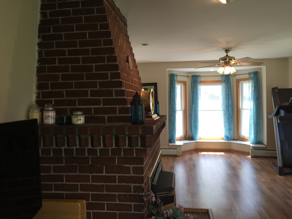 69 East Main Street Rindge, NH 03461 - Photo 8 of 27 a view of a livingroom with wooden floor and a large window