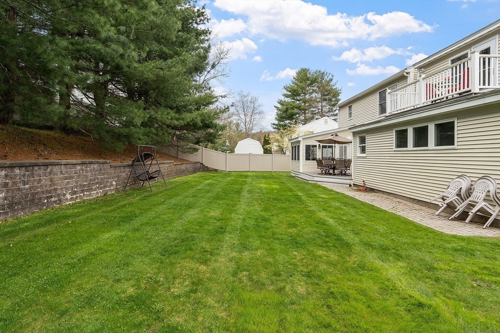 9 Robbins Road Ayer, MA 01432 - Photo 36 of 40 a front view of a house with garden