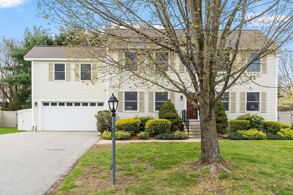 9 Robbins Road Ayer, MA 01432 - Photo 4 of 40 a white house that has a tree in front of the house