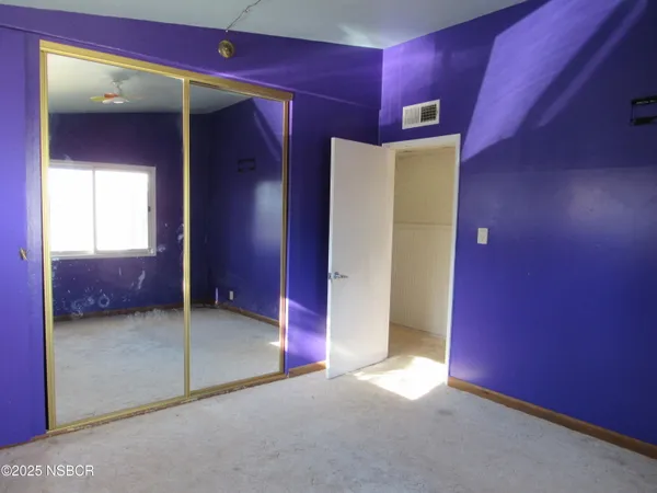 a view of a livingroom with a staircase