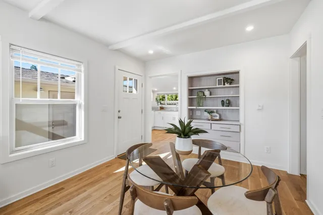 a kitchen with a refrigerator and a sink