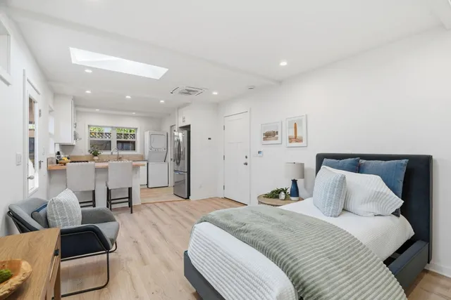 a bathroom with a sink shower and a mirror